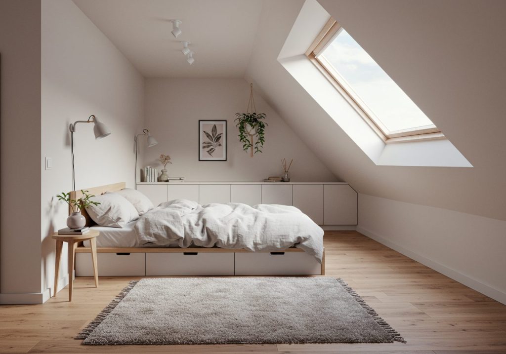 Slanted wall bedroom with skylight, low platform bed, soft white and pastel decor, built-in storage under the angled ceiling, and cozy Scandinavian styling