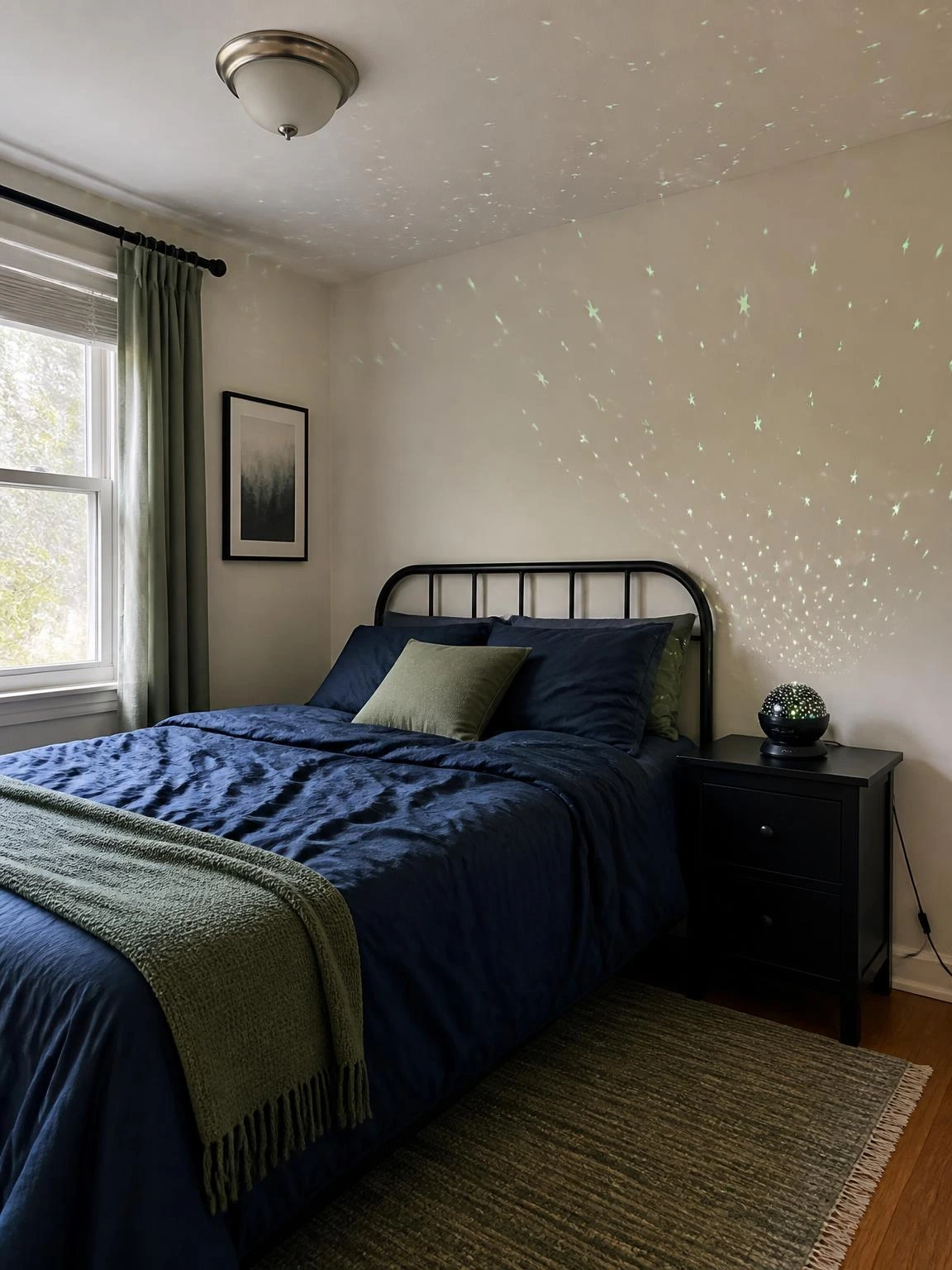 Compact bedroom with a star projector casting subtle stars above navy bedding, showing Halloween aesthetic bedroom decor without clutter