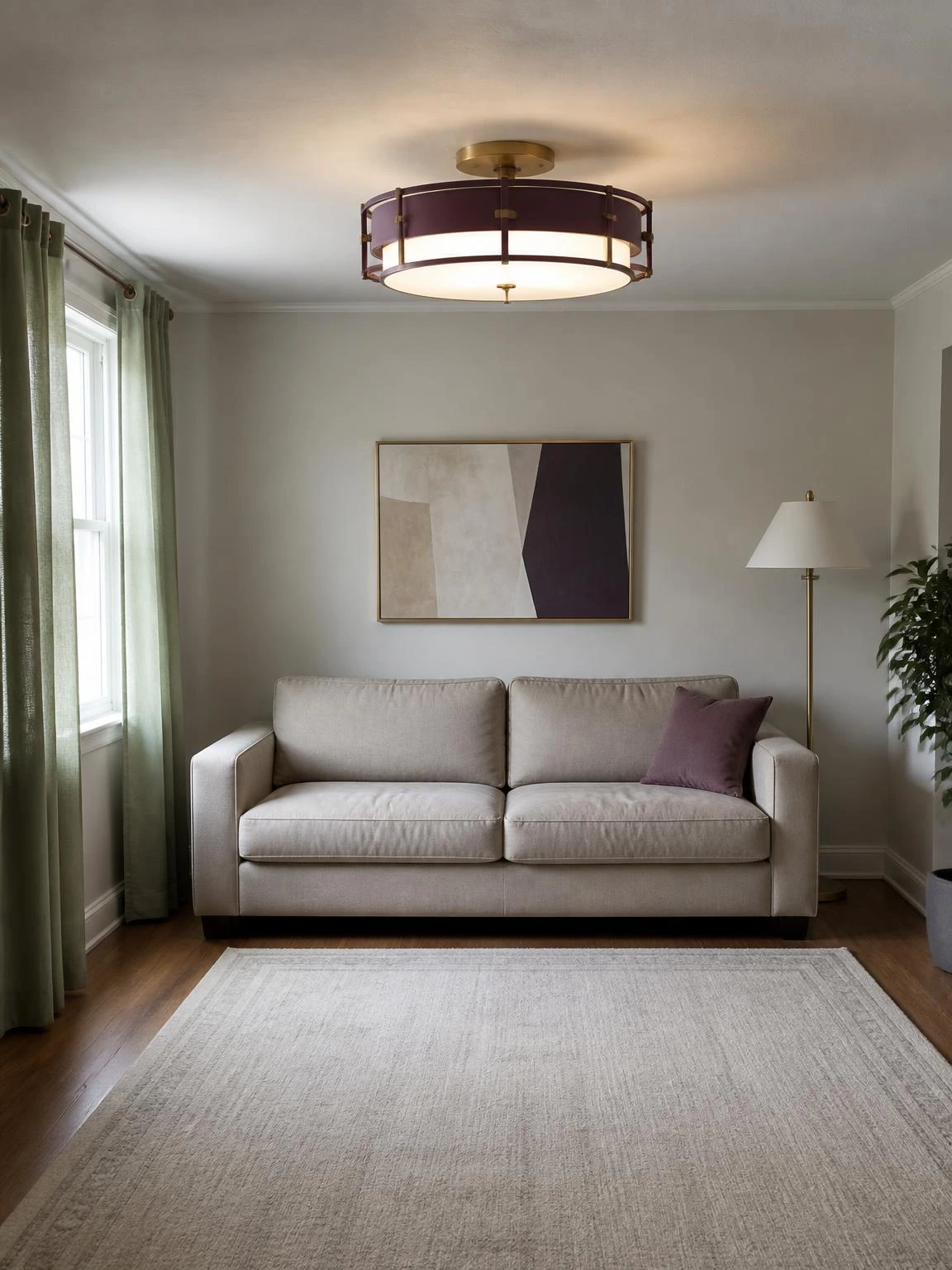Muted plum and brass semi-flush chandelier above a sofa, illustrating living room chandelier ideas for low ceilings