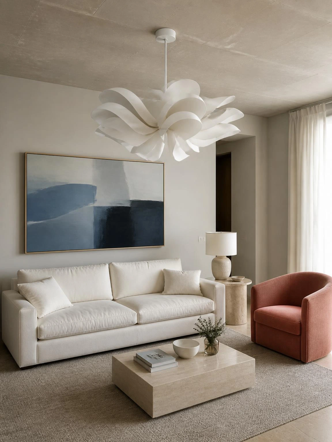 Sculptural white chandelier above an ivory sofa, with coral seating and blue art shaping contemporary living room ideas