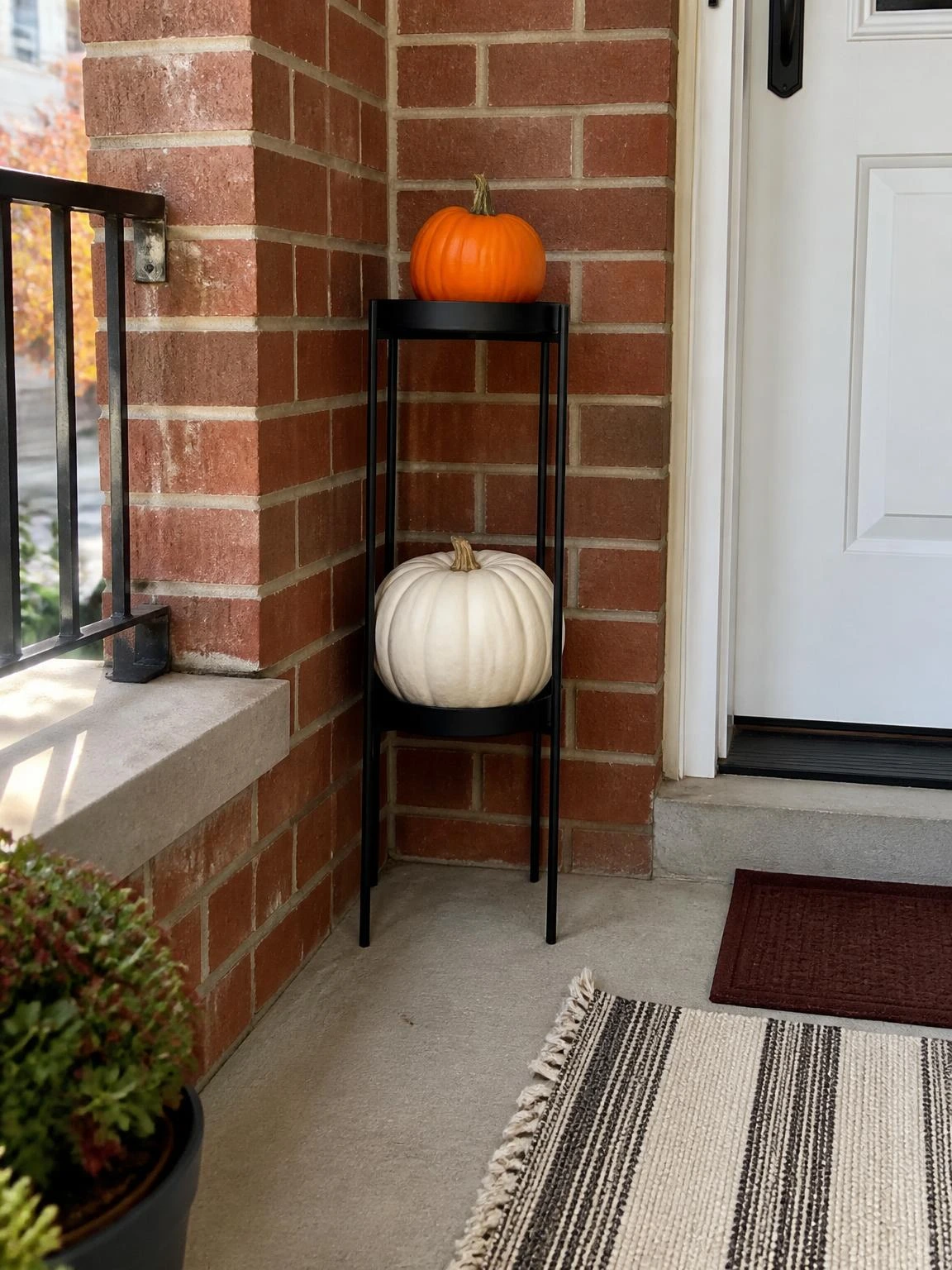 6- Tiered Plant Stand as Pumpkin Display Tower - halloween porch ideas for small spaces